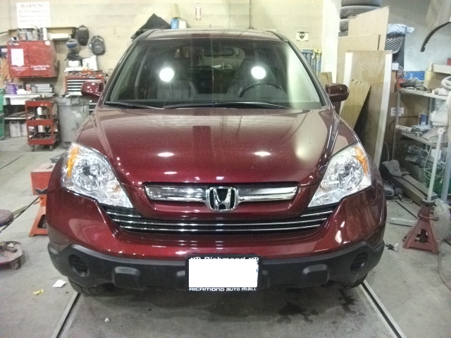 An after photo of red CRV got repaired from a car accident