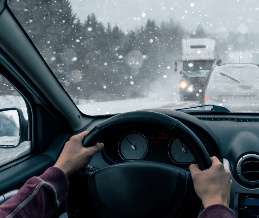 Image of someone driving in the winter