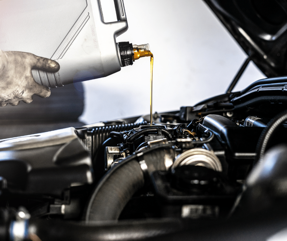 Image of oil being poured into car engine